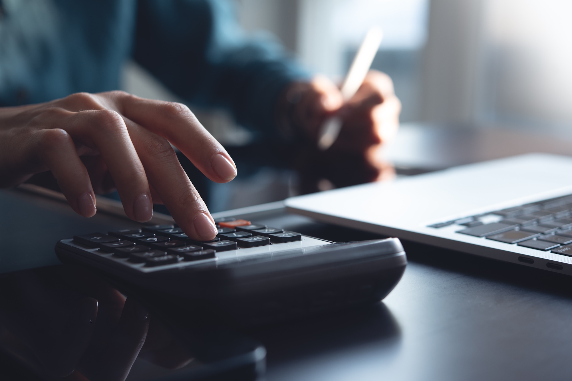 person using calculator