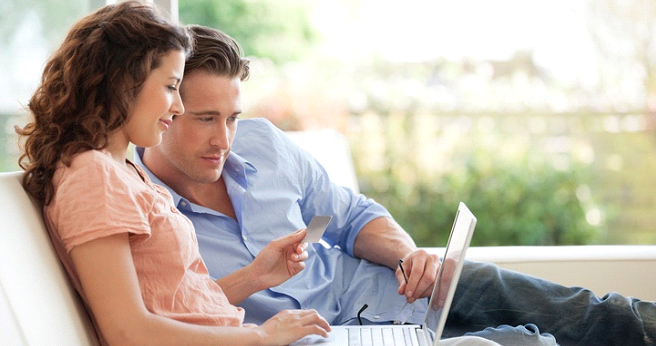 Couple making online purchase with credit card